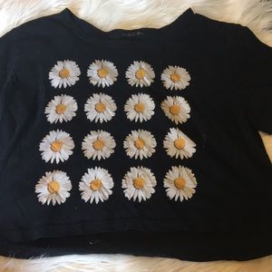 black t shirt w daisy’s on it.